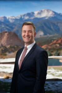 Chris Karpov as Director of Front Office of Garden of the Gods Resort and Club