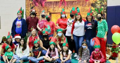 Interval International employees volunteer to distribute toys, during the company’s 28th annual Holiday Toy Fest at the Gibson Bethel Community Center in South Miami.