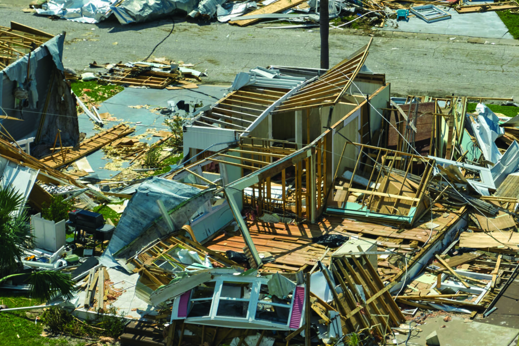 Destroyed by hurricane Ian suburban houses in Florida mobile home residential area. Consequences of natural disaster.