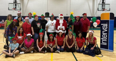 Interval International associates during the company’s 29th annual Holiday Toy Fest at the Gibson Bethel Community Center in South Miami.